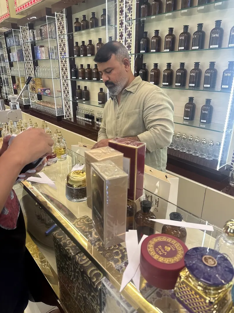 At the counter inside Sartaj Perfumes